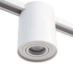 Witte railspot met ronde afdekring en donkere inbouwmodule