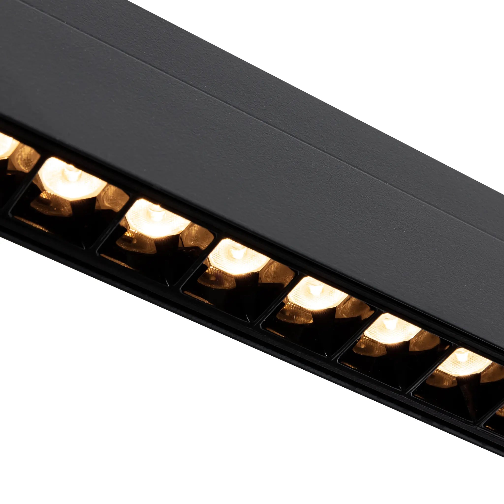 Zwarte railverlichting met warm verlichte LED-dots in zwarte behuizing