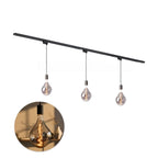 Hanglampenset met zwarte rail en drie hanglampen met amberkleurig gloeidraadlicht